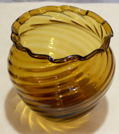 Amber glass vase, ribbed swirl, folded rim