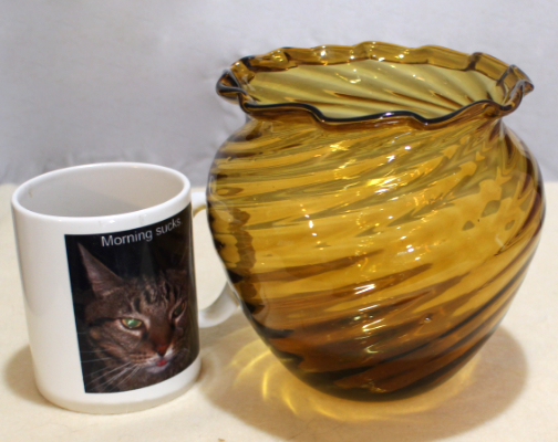 Amber glass vase, ribbed swirl, folded rim